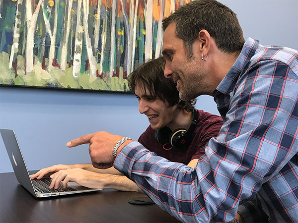 Gersh Experience student and tutor working on a laptop